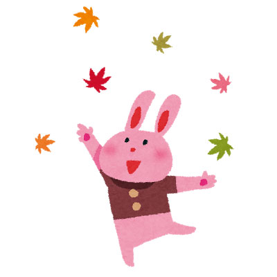 舞い散る紅葉の中で楽しそうにはしゃぐウサギのかわいいイラスト