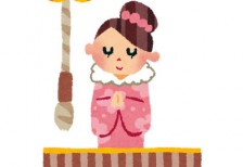 ピンクの花柄の着物を着て賽銭箱の前でお参りをする女性を描いたイラスト