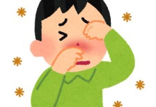 痒い目と鼻を辛そうにこする花粉症の男性のイラスト